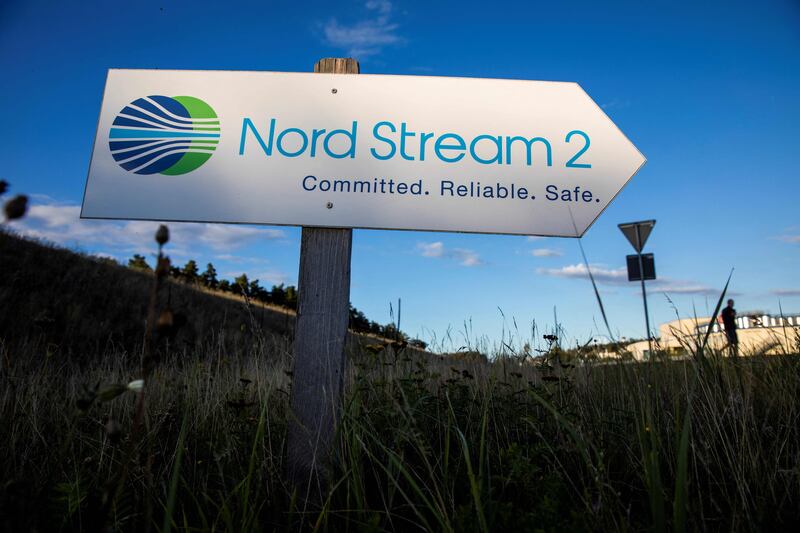 A road sign directing traffic towards the Nord Stream II gas line landfall facility entrance in Lubmin. Germany has suspended certification of the pipeline as part of sanctions against Russia. Photo: AFP