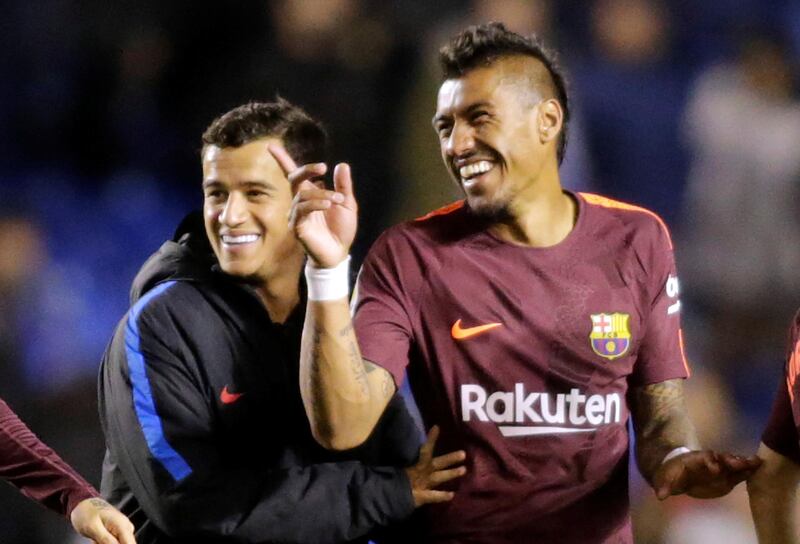 Barcelona's Paulinho celebrates winning La Liga with Philippe Coutinho, who joined the team from Liverpool FC for an an initial £105 million earlier this season. REUTERS/Miguel Vidal