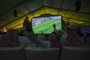 Saudi football supporters react while watching their national team play during their Russia 2018 World Cup Group A football match against Uruguay at a fan tent in the Red Sea coastal resort of Jeddah on June 20, 2018. Amer Hilabi / AFP
