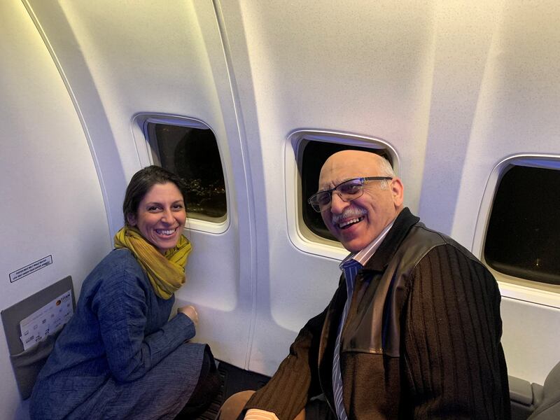 Ms Zaghari-Ratcliffe and Mr Ashoori as their plane flies over London. Reuters
