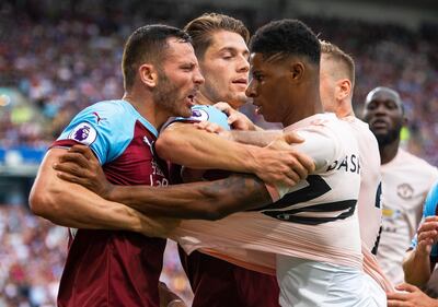 epa06992842 Manchester United's Marcus Rashford (R) clashes with Burnley's Phillip Bardsley (L) during the English Premier League soccer match between Burnley FC and Manchester United in Burnley, Britain, 02 September 2018.  EPA/PETER POWELL EDITORIAL USE ONLY. No use with unauthorized audio, video, data, fixture lists, club/league logos or 'live' services. Online in-match use limited to 120 images, no video emulation. No use in betting, games or single club/league/player publications.