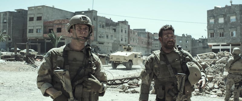 Jake McDorman and Bradley Cooper in American Sniper. Courtesy Warner Bros Pictures