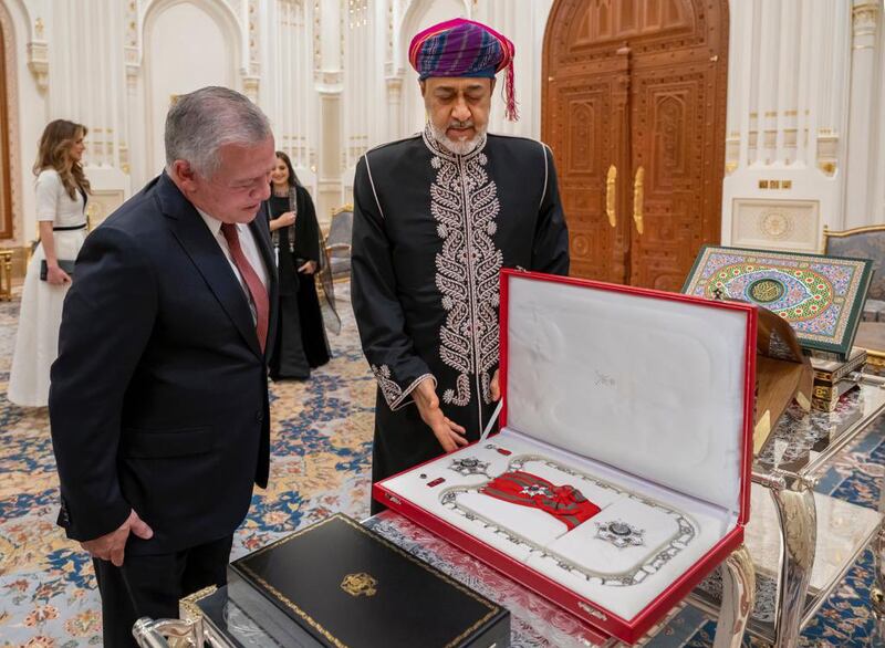 Sultan Haitham of Oman presents a medal to Jordan's King Abdullah II. Photo: Oman News Agency