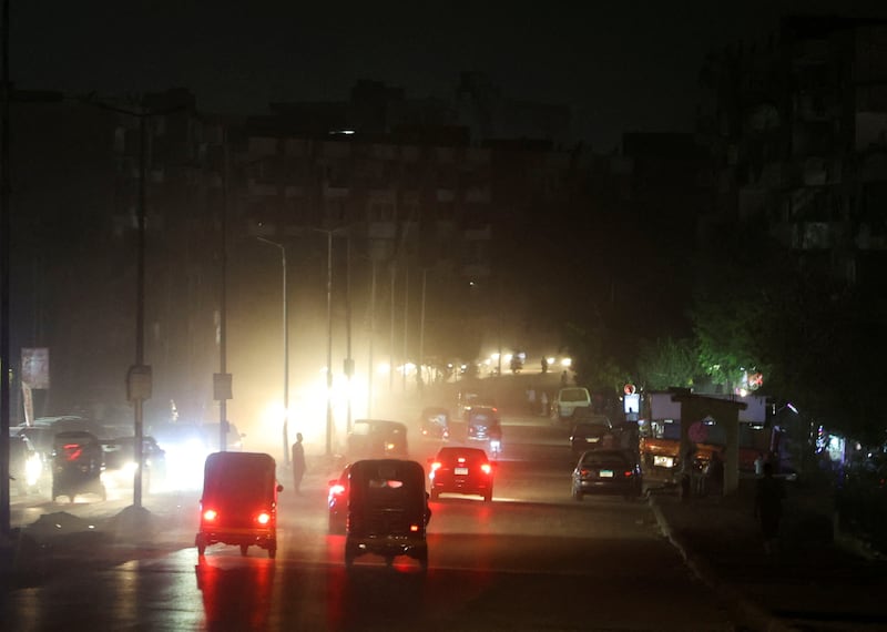 A dark road during a power cut in Cairo. Reuters
