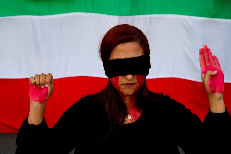 A during a protest at Catalunya Square, Barcelona, in support of Iranian women and against the death of Mahsa Amini. Reuters