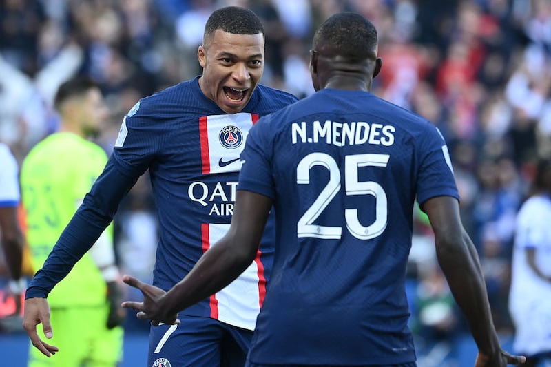 Mbappe celebrates with Nuno Mendes after opening the scoring. AFP