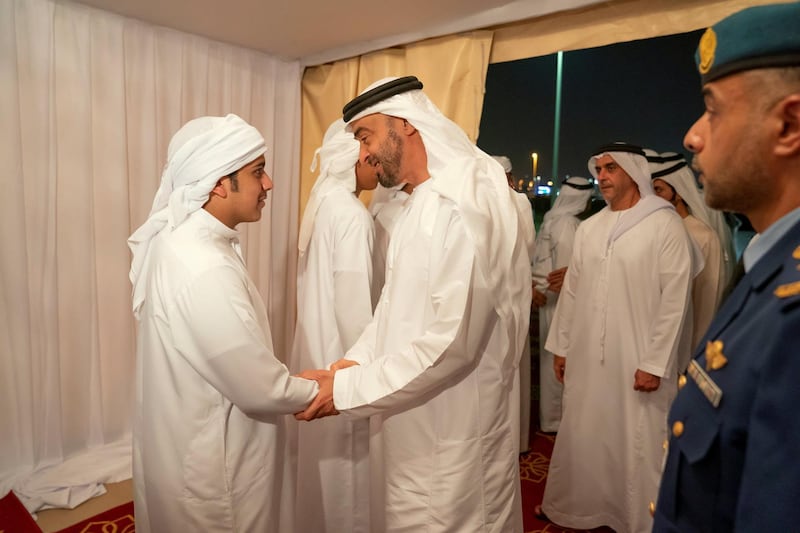 BANIYAS, ABU DHABI, UNITED ARAB EMIRATES - September 15, 2019: HH Sheikh Mohamed bin Zayed Al Nahyan, Crown Prince of Abu Dhabi and Deputy Supreme Commander of the UAE Armed Forces (C), offers condolences to the family of martyr Warrant Officer Saleh Hassan Saleh bin Amro. Seen with HH Lt General Sheikh Saif bin Zayed Al Nahyan, UAE Deputy Prime Minister and Minister of Interior (back R). 

( Mohamed Al Hammadi / Ministry of Presidential Affairs )
---