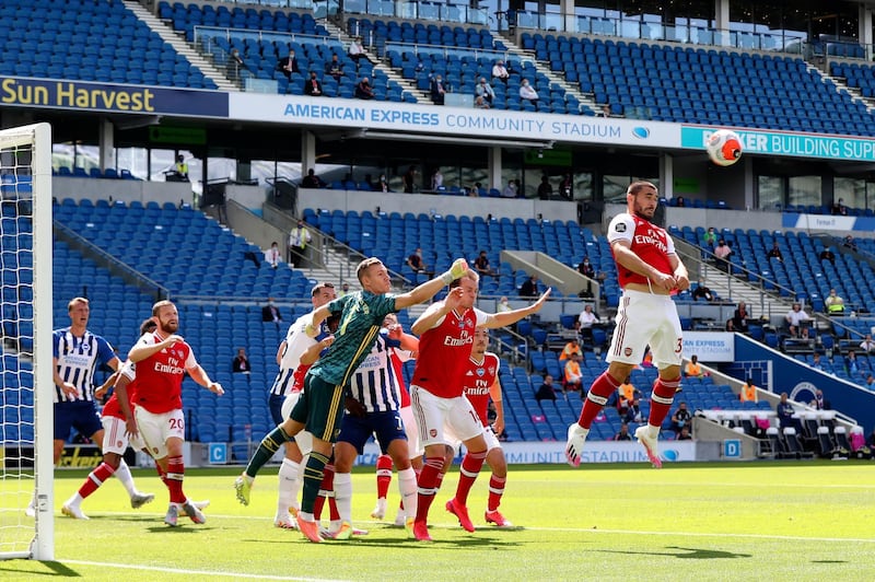 Arsenal's Sead Kolasinac, right, heads the ball during the match against Brighton & Hove Albion at the AMEX Stadium on Saturday. AP