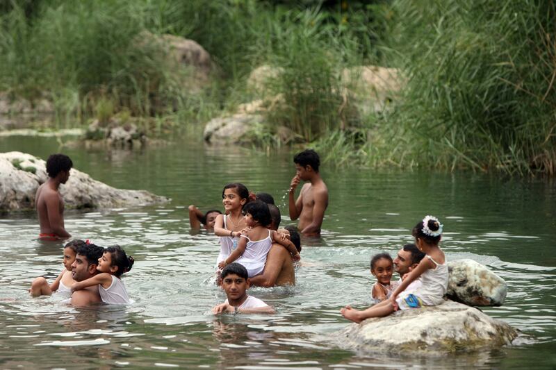 SALALAH . 16th July. 2009 .Families swim in a natural spring at Ayn Razat, east of  Salalah.  Stephen Lock  /  The National . FOR TRAVEL. *** Local Caption ***  SL-salalah-018.jpg