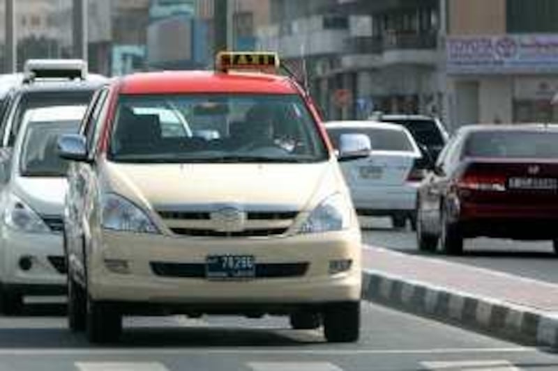 

DUBAI, UNITED ARAB EMIRATES – May 14: Taxi on Dubai roads. (Pawan Singh / The National) For news
 *** Local Caption ***  PS06- DUBAI TAXI.jpg