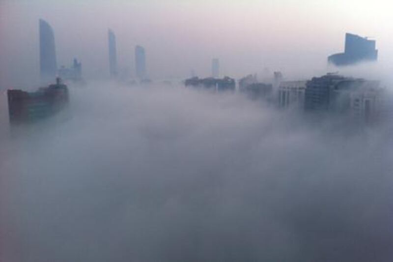 Fog covers Abu Dhabi's Corniche as the misty conditions return. Scott Armstrong