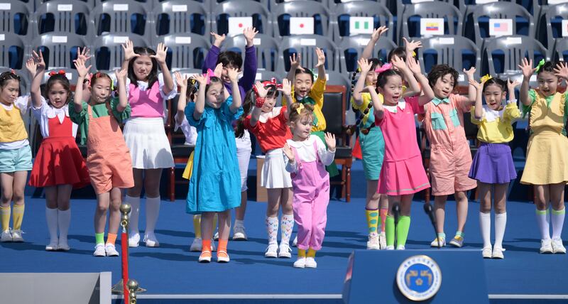 Children entertain guests at the ceremony. EPA