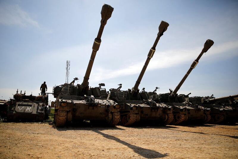 An Israeli soldier stands atop of an APC next to a battery of cannons near the border with Gaza, in southern Israel March 28, 2019. REUTERS/Amir Cohen