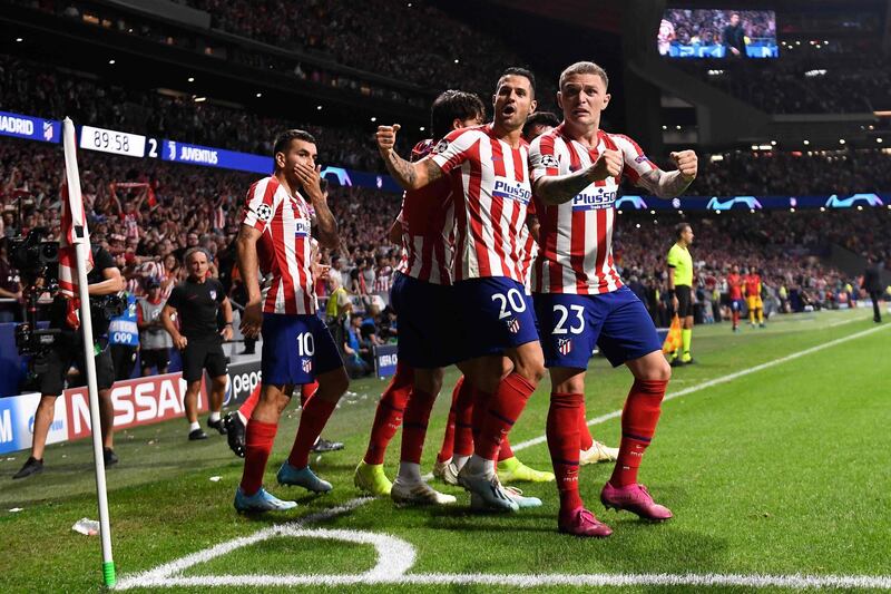 Atletico Madrid's Hector Herrera celebrates scoring their second goal to make it 2-2, the final result. AFP