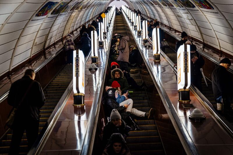 Ukrainian civilians take shelter inside a metro station during an air raid alert in the centre of Kyiv. AFP