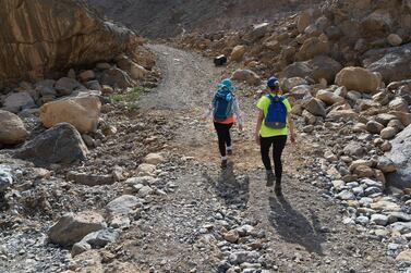 A hiking group walks through Leopard Canyon in Ras Al Khaimah. Mountain rescuers said hikers can be easily overcome by high temperatures. PJ van Schalkwyk for The National