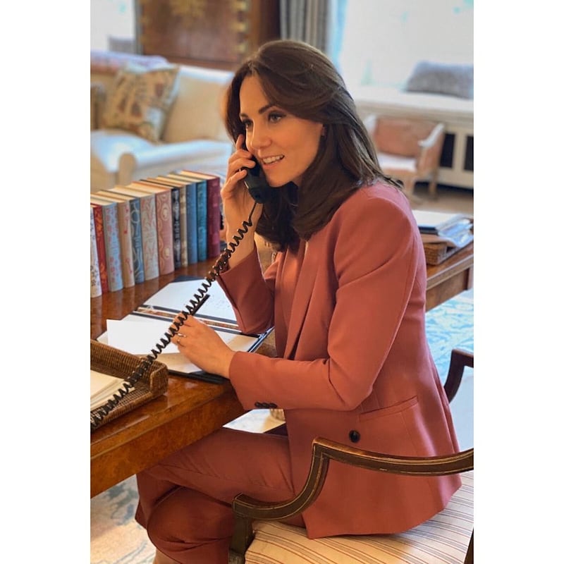 The Duchess of Cambridge wears a pink Marks & Spencer suit to work from home at Kensington Palace on March 30. She later re-wore the trousers for a Park Parenting Meet-up in September. Kensington Palace / Instagram