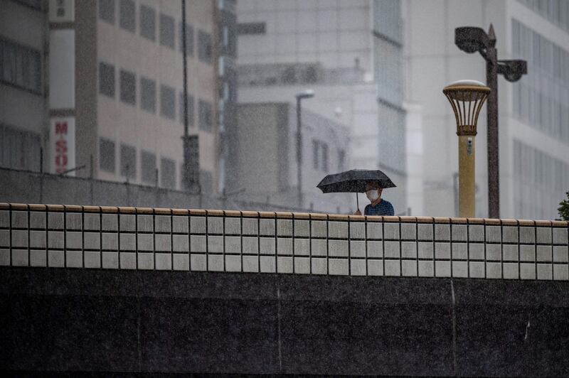 The approaching weather system brings heavy rain to Tokyo. AFP