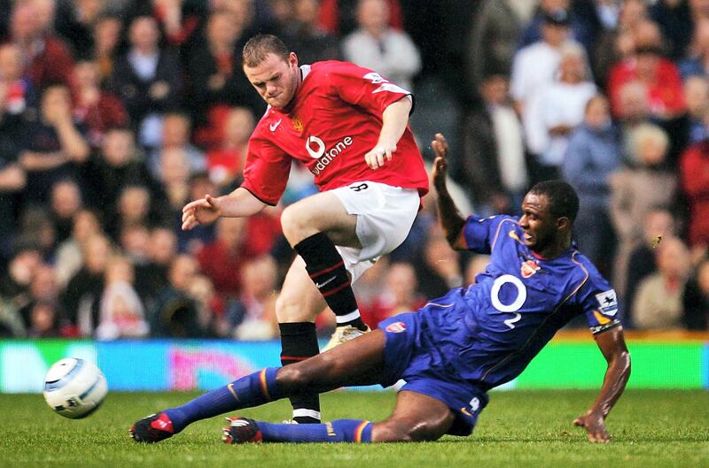 MANCHESTER, ENGLAND - OCTOBER 24: Wayne Rooney of Manchester United battles with Patrick Vieira of Arsenal during the FA Barclays Premiership match between Manchester United and Arsenal at Old Trafford on October 24, 2004 in Manchester, England.  (Photo by Laurence Griffiths/Getty Images)