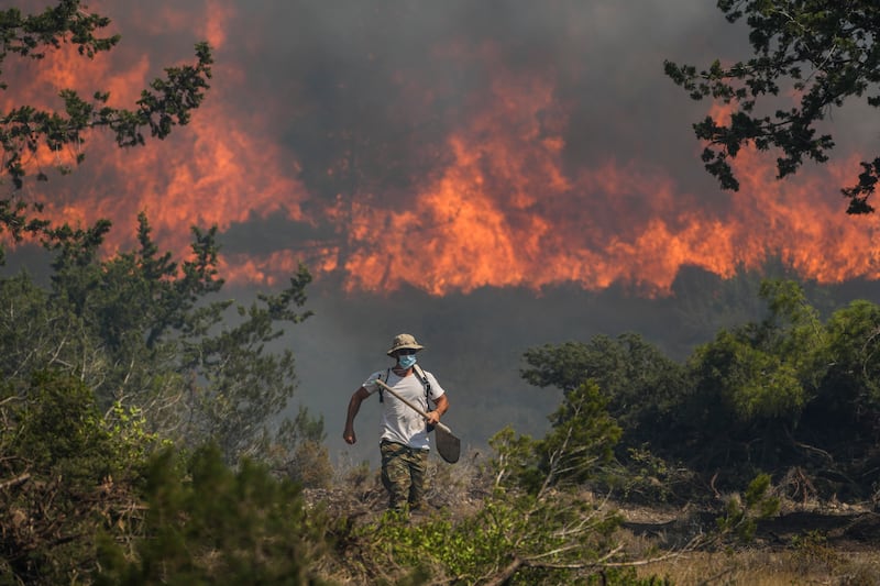 A forest fire burns near Vati village, on the island of Rhodes. AP