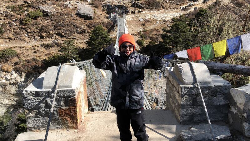 The journey involved many bridges. Oscar Pacheco is pictured on his way from Tengboche to Dingboche.