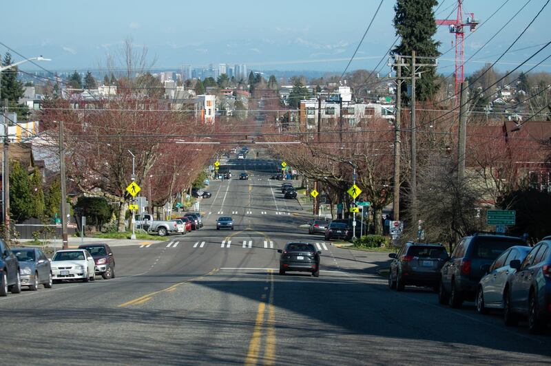 Vehicles travel along a near-empty road in Seattle, Washington on March 18, 2020. Bloomberg