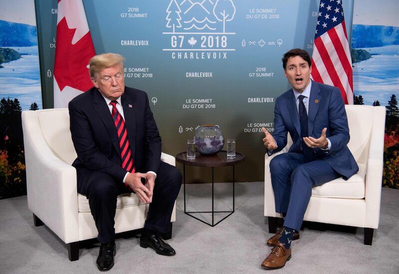 (FILES) In this file photo taken on June 08, 2018, US President Donald Trump and Canadian Prime Minister Justin Trudeau hold a meeting on the sidelines of the G7 Summit in La Malbaie, Quebec, Canada. - Canada and the United States faced roadblocks as they went down to the wire Friday, August 31, 2018, in talks to salvage the North American Free Trade Agreement, and one may have come from dealmaker-in-chief Donald Trump. With the US deadline to get an agreement by Friday, there were reports the sides were struggling to find compromise on the NAFTA mechanism for resolving trade disputes and on Canada's managed dairy market. (Photo by SAUL LOEB / AFP)