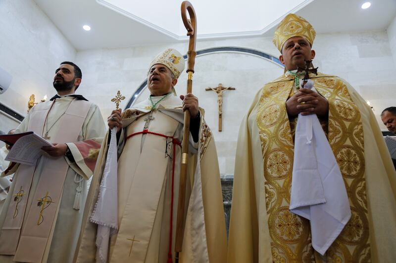 An Iraqi priest holds a mass at the monastery. Reuters