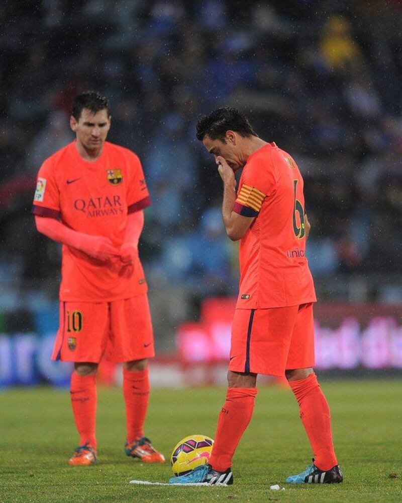 Lionel Messi and Xavi shown during their side's 0-0 draw with Getafe in La Liga on Saturday. Denis Doyle / Getty Images / December 13, 2014