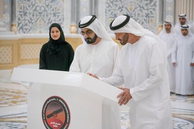 ABU DHABI, UNITED ARAB EMIRATES - January 05, 2020: HH Sheikh Mohamed bin Zayed Al Nahyan, Crown Prince of Abu Dhabi and Deputy Supreme Commander of the UAE Armed Forces (R) and HH Sheikh Mohamed bin Rashid Al Maktoum, Vice-President, Prime Minister of the UAE, Ruler of Dubai and Minister of Defence (2nd R), sign a piece of the Hope Probe, which will be launched to Mars in July, at Qasr Al Watan.

( Hamad Al Kaabi / Ministry of Presidential Affairs )
---