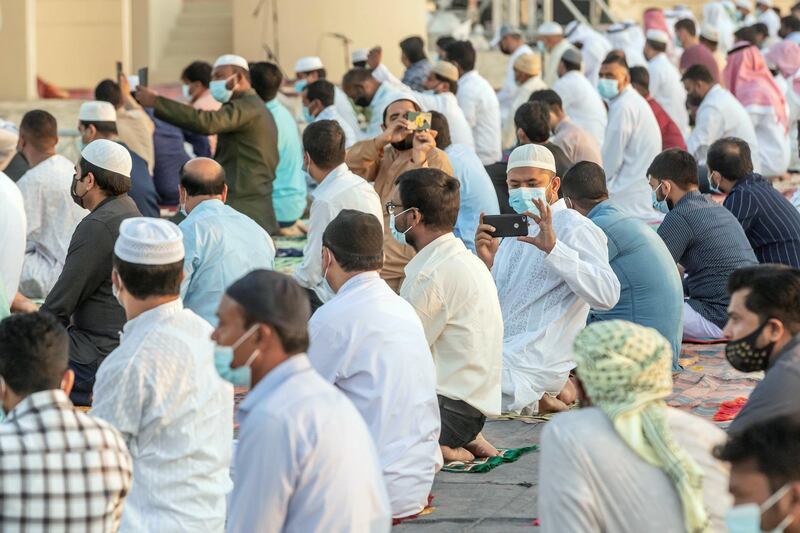 Eid prayers, also known as Salat al-Eid and Șālat al-'Īdayn, is the special prayers (salah) offered to celebrate the Islamic festival at the end of the Holy Month of Ramadan. Traditionally it is held in an open space, Eidgah, such as an allocated spcae or field specifically available for prayer. The UAE Authorities allowed communal Eid prayers again this year with a strict policy of social distancing anf a 15 minite prayer access throughout the UAE after last years locdown due to the Covid - 19 pandemic. Worshippers attend the Eid Prayer at the Umm Suquim Eid prayer grounds on May 13 th, 2021. 
Antonie Robertson / The National.
Reporter: None for National.