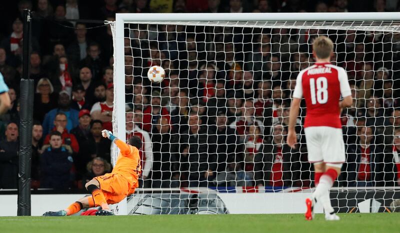 Cologne's Jhon Cordoba scores his team's first goal past Arsenal's David Ospina. David Klein / Reuters