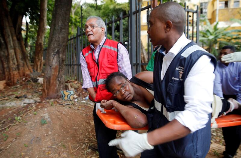 A woman is evacuated. Thomas Mukoya / Reuters