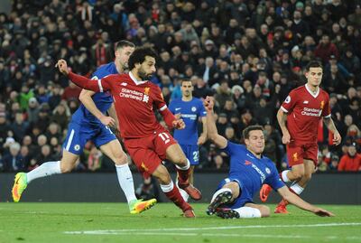 Liverpool's Mohamed Salah, centre, scores during the English Premier League soccer match between Liverpool and Chelsea at Anfield, Liverpool, England, Saturday, Nov. 25, 2017. (AP Photo/Rui Vieira)