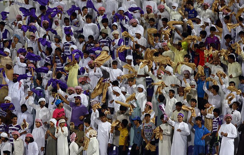 Al Ain, United Arab Emirates- April, 18,  2013:  Al Ain fans celebrates the victory against Dubai during tthe Etisalat Pro-League match  at the  Tahnon Bin Mohamed Stadium  in Al Ain .  (  Satish Kumar / The National ) For Sports