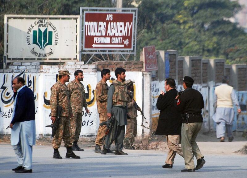 Taliban gunmen in Pakistan took hundreds of students and teachers hostage on Tuesday in a school in the northwestern city of Peshawar, military officials said.  Khuram Parvez / Reuters