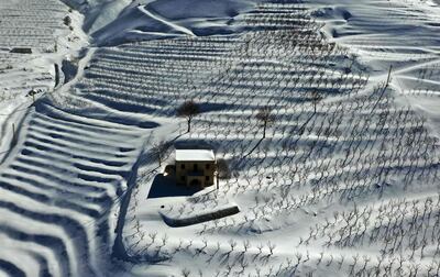 TOPSHOT - An aerial picture shows a blanket of snow covering agricultural fields in the Tannourine area in the Lebanese mountains, on January 22, 2021. / AFP / JOSEPH EID
