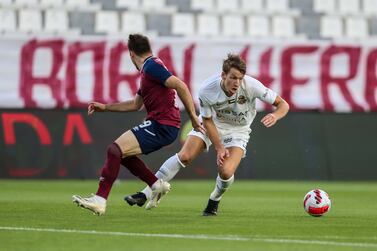 Thomas Olsen, white, scored twice in Shabab Al Ahli’s 3-1 win over Al Wahda in the Pro League second-leg semi-final at Al Nahyan stadium on Tuesday, March 8, 2022. - PLC