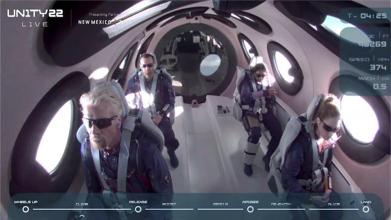 Mr Branson, his fellow passengers and crew on board the 'VSS Unity'.
