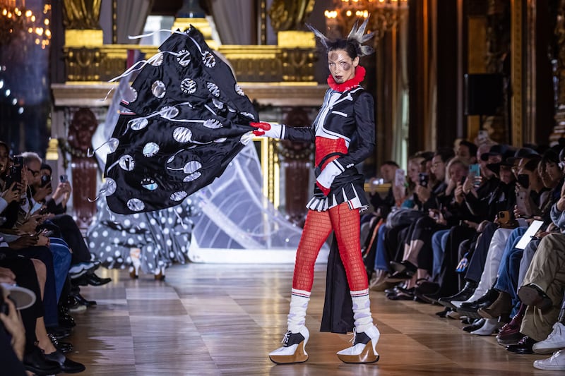 Bella Hadid presents a creation from the spring/summer 2023 ready-to-wear collection by US designer Thom Browne at Paris Fashion Week. EPA