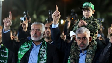 Hamas leaders Ismail Haniyeh, left, and Yahya Sinwar attend a memorial service for one of the group's fighters in Gaza city in March 2017. Reuters