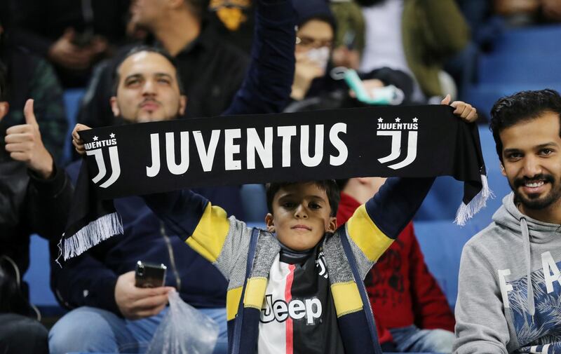 A Juventus fan inside the stadium before the match. Reuters