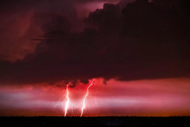 Lightning is seen above the city of Plock, in central Poland. EPA