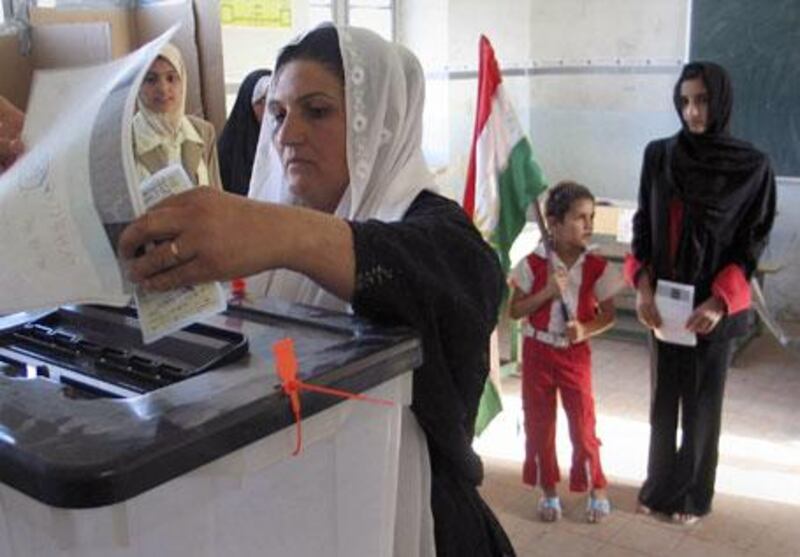 Kurdish women vote in Iraq's constitutional referendum in the northern city of Kirkuk in October 2005.