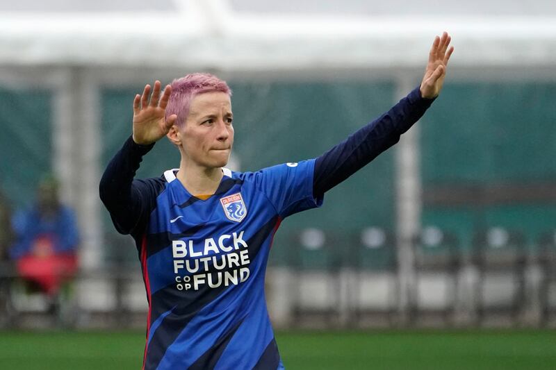 Rapinoe waves to her legions of fans. AP