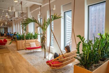 A member of the co-working space sits in a lounge area at the WeWork on 85 Broad Street in Manhattan. Bloomberg