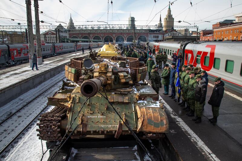 A Russia made tank T-55 stands aboard a train. AP Photo
