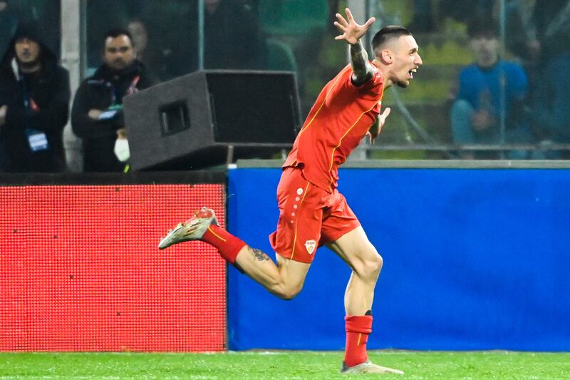 North Macedonia's Aleksandar Trajkovski celebrates after scoring the only goal of the game against Italy. AFP