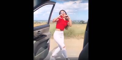 A screenshot of a woman doing the KiKi challenge posted on Youtube.