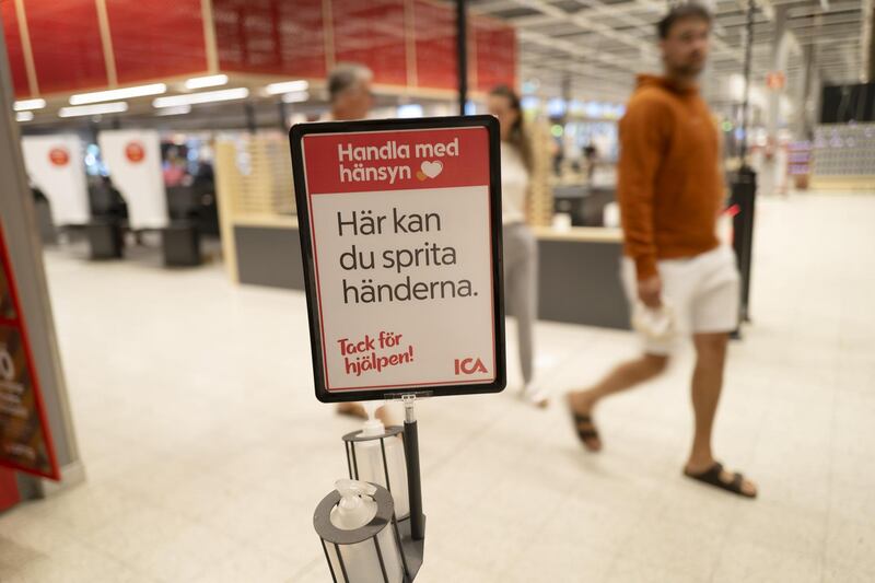 Hand sanitisers are placed in the aisles of a supermarket in Gotland, Sweden. Getty Images